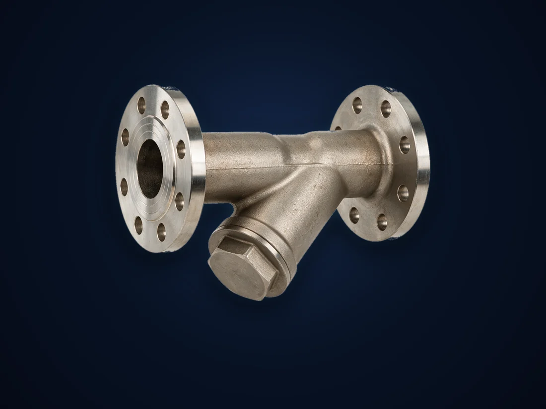 A stainless steel flanged Y-pattern strainer, screen access cap on the angled leg
