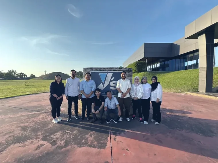 Optimus team photographed outside the Yoshitake Works factory in Thailand
