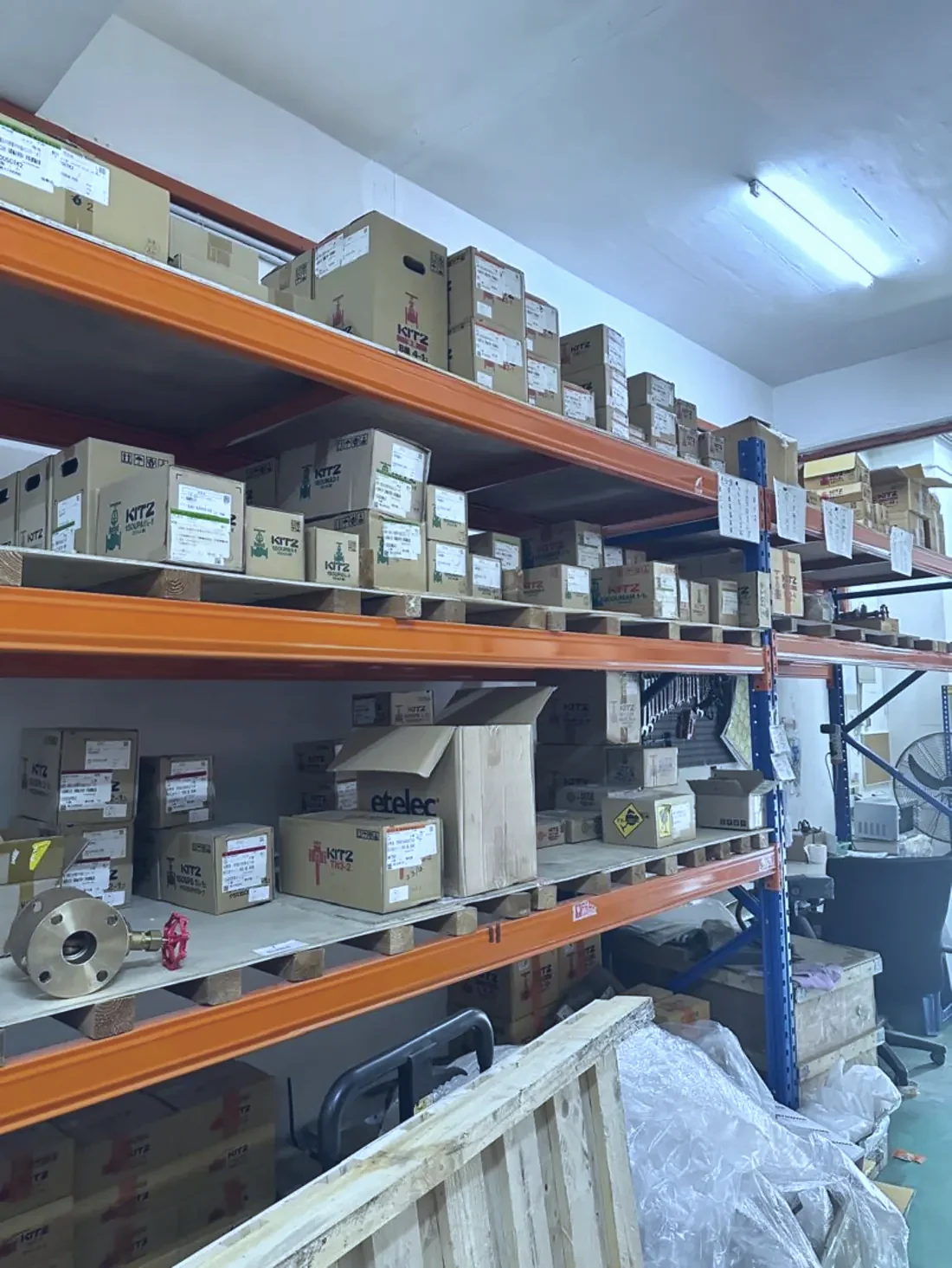 Boxed stock on the shelving runs at the Optimus Distributor warehouse in Subang Jaya